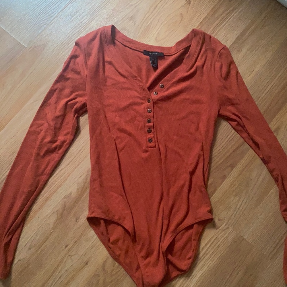 Burnt orange button up bodysuit